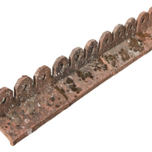 A short run from a batch of Redland concrete crested ridge tiles showing the heavy weathering of lichen and moss