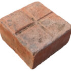 Detail of Rare, reclaimed square red stable pavers showing weathered surfaces and worn edges