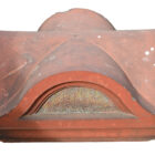 A profile image of one of a pair of well weathered Victorian terracotta pier caps, showing a fabulous patina of lichen and organic discolouration.