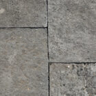 Reclaimed and weathered limestone paving in a classic blue/buff colour and showing highly desirable aged patina