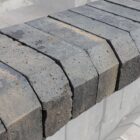 Detail of structurally sound, new old stock (new concessions) XL blue double cant bricks, with a light patina from some years in storage.