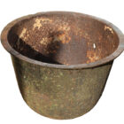 An antique cast iron wash boiler with a textured patina that's perfect for garden planter or water feature