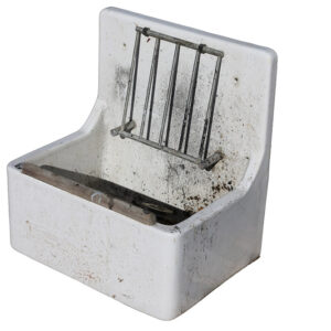 A reclaimed Armitage Shanks "Birch" commercial butler sink with integral draining grate and tall splashback