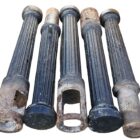 Part of a set of 10 reclaimed cast iron fluted bollards with both removable and fixed items and an authentic aged patina of flaking black pint and surface corrosion
