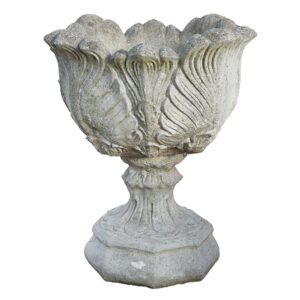 A beautifully weathered composite stone tulip design urn on an uncommon octagonal base