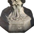 A an uncommon octagonal base on a beautifully weathered composite stone tulip design urn