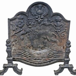 A heavily weathered, cast iron fire back with basket and dogs commemorating an historic battle in the North of England