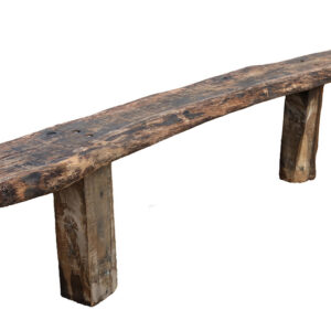 A large bespoke, hand crafted garden bench made of reclaimed oak beams and seasoned sleepers, with a natural edge on the seat and two chunky square legs.