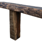 A hand crafted wooden garden bench with reclaimed oak top and seasoned oak sleepers as legs
