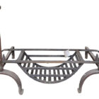 A reclaimed wrought iron Inglenook fire basket and fire dogs with authentic surface patina