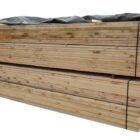 A large stack of new unbranded scaffold boards ready to build raised beds and rustic furniture but uncertified for use as scaffold boards in construction projects