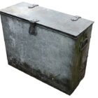 A weathered and reclaimed galvanised feed store with an aged patina of discoloration, algae and general oxidisation.