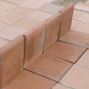 A short run of heather brown skirting quarry tiles from the Dennis Ruabon Hafodex range, with a bullnose edge and minor colour variation