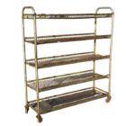 A reclaimed and heavily weathered Northampton shoe factory rack with wheels showing an authentic aged patina
