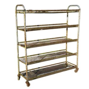 A reclaimed and heavily weathered Northampton shoe factory rack with wheels showing an authentic aged patina