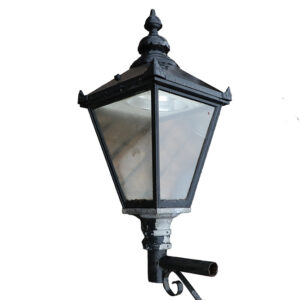 A weathered Victorian style garden lantern with patina of peeling black paint