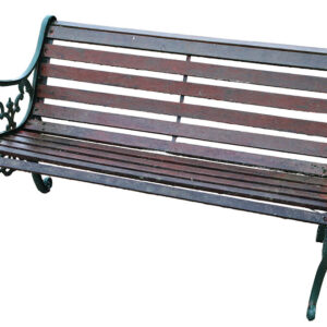 A weathered vintage wooden bench with cast iron lion head ends