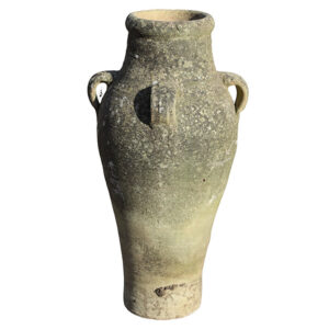 A well weathered composite stone vase with four handles and a slim profile showing a lovely patina of discolouration and lichen.